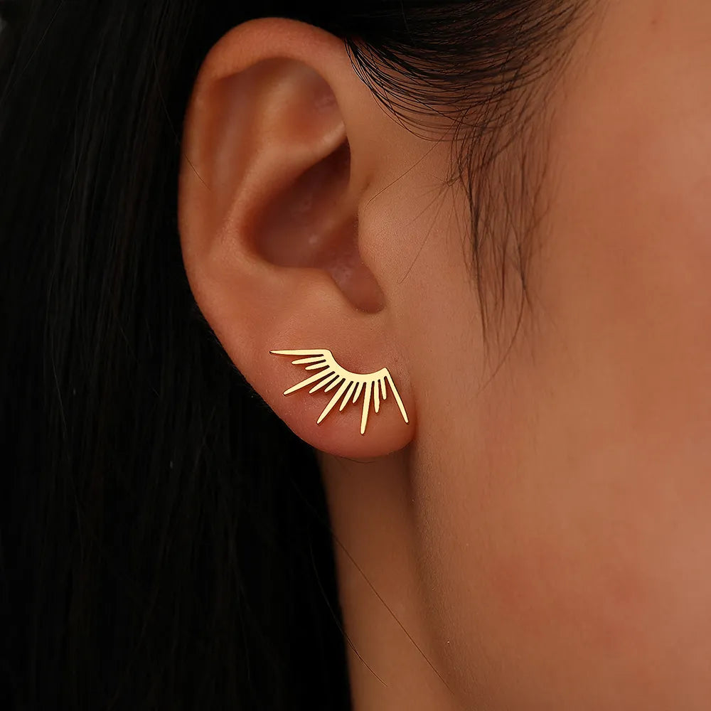 Boucles d'oreilles gothiques avec motif soleil